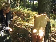 A Mature German Domina Spanks Her Man In The Woods