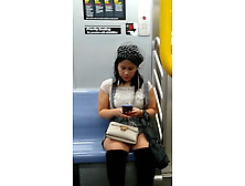 Cute Asian On The Train In Boots And A Skirt.  Cutie