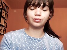 Brunette hair with natural large lips with natural color lipgloss smokin' a cigarette blowing smoke in your face