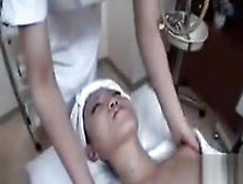 Slim Japanese doll gets touched by two hot lesbian masseuses