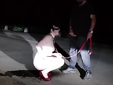 Naked milf in heels pisses on the road