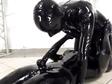 2 lesbian in latex catsuit