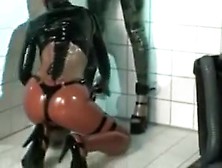 Submissive Lesbian Slut Anal Inflatation In Latex Black Body