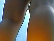 Chick with stretched legs dressing up in change room