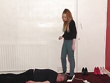 High-Heeled Babe Dances And Tramples Slaves Head