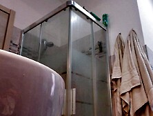 Lascivious blond shows her titties in the baths stall