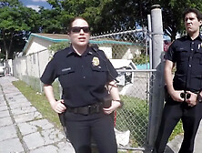 Black Suspect Is Receiving A Deep Throat From Two Milfs With Big Tits