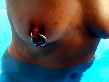 nippleringlover fine mom swimming nude in pool see through pierced nipples humongous rings in pierced cunt lips