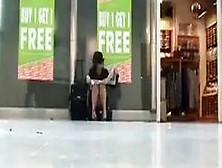 Sitting upskirt at the airport
