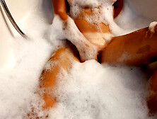 Busty blonde teen masturbates in the bath