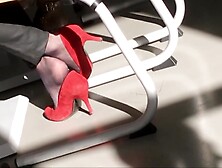 secretary in nylon socks and red high heels