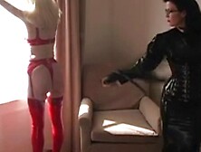 Chicks in purple and red latex whipping ass