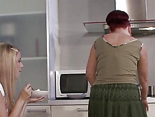 Mom And Lesbian Teen Have Fun On The Kitchen