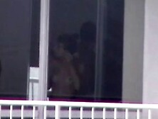 topless girl applying sunscreen voyeur thru windown in