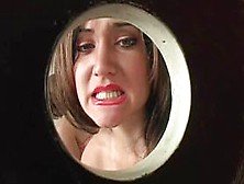 Naked hottie fellating hard cock in gloryhole