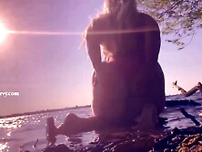 Bikini ass teasing in the water at a public beach!