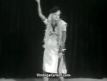 A Guy In A Gorilla Suit Plays With A Sexy Blonde On Stage