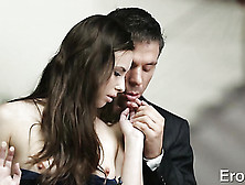 Guy Carefully Undresses Brunette Girl With Long Hair As She Stands In Front Of Glass Window