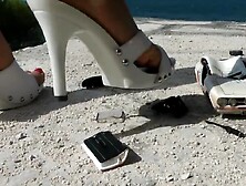 Heels crushing a metal car