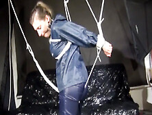 Get 2 Videos With Sandra Enjoying Bondage In Her Shiny Nylon Rainwear From Our 2016 Archive