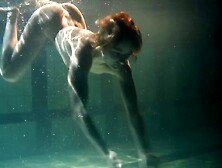 Redhead solo model teen showcasing her nice ass in the pool