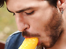 Cute Bearded Dude Licks A Dick Shaped Lollipop In An Open Area Near The Bridge