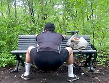Biker In Spandex Stretching At The Park