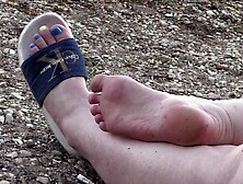 Women's legs in slippers.