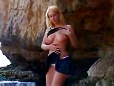 Sexy Sonia strips by the sea FM14