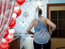 Lukerya,  the warm housewife,  enjoying her time in the kitchen at home
