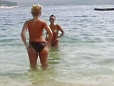 Two busty German babes sharing a loaded pecker outdoors