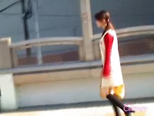 Hot girl with a yellow bag skirt sharked on the stairs