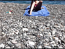 Cute exhibitionist girl get naked in public beach
