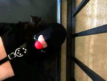 Gagged and Hooded Serf struggles in Straitjacket Whilst In Cage