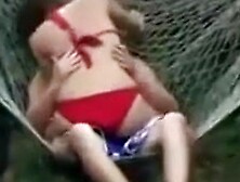 Blowjob In A Hammock From A Voluptuous Bikini Girl