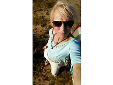 Trans Girl Swimming In The Lake In Clothes Blue Blouse And White-Milk Pants.