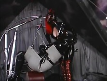 Latex Bondage Machine Swinging And Turning