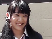 Little Japanese schoolgirl toys pussy over panties in public
