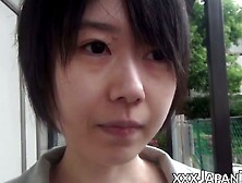 Young Japanese woman shows off butt and twat
