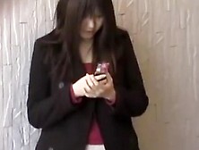 Feisty Young Japanese Slut Holding Her Phone During Sharking Adventure