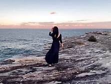 Sea Waves, Cliff and the Slut Young Woman