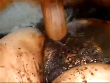 Excited man is screwing a excited woman in the mud and enjoying it a lot