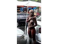 Crazy Ebony Taking A Shower In The Rain In Public