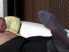 Young bound jock laughs while his captor tickles his feet