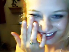 Smiling blonde is sucking a dick on the cam