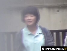 Bad Japanese students pee outdoors strolling school to home