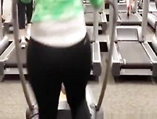 Woman in tight sports pants exercising