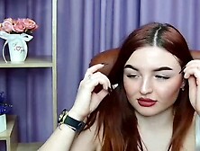 Redhead babe flashes big natural tits