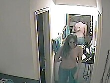 Woman takes off pajama in bedroom