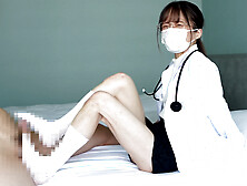 Japanese school nurse gives a guy a footjob.